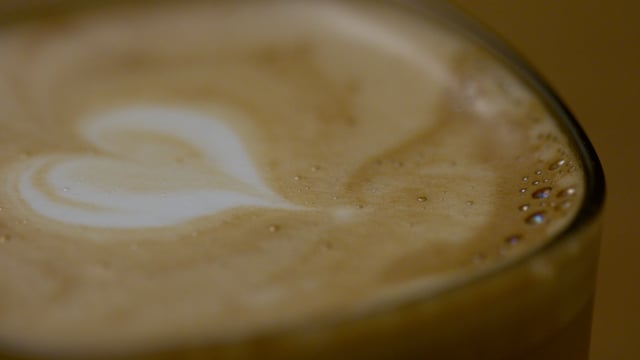Beautifully executed foam art on a warm and inviting latte. 