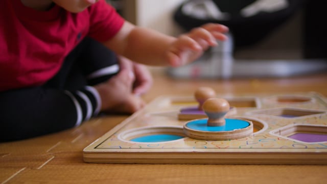 Young children learning at home with interactive game. 