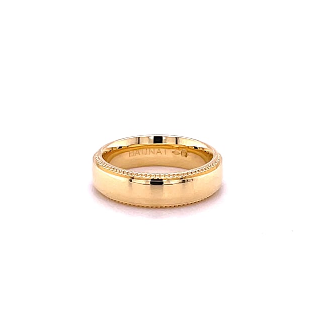 Wedding ring with a slightly domed surface of 6.00 mm in yellow gold with milgrain