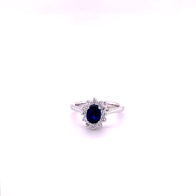 Entourage ring in platinum with an oval sapphire and round diamonds