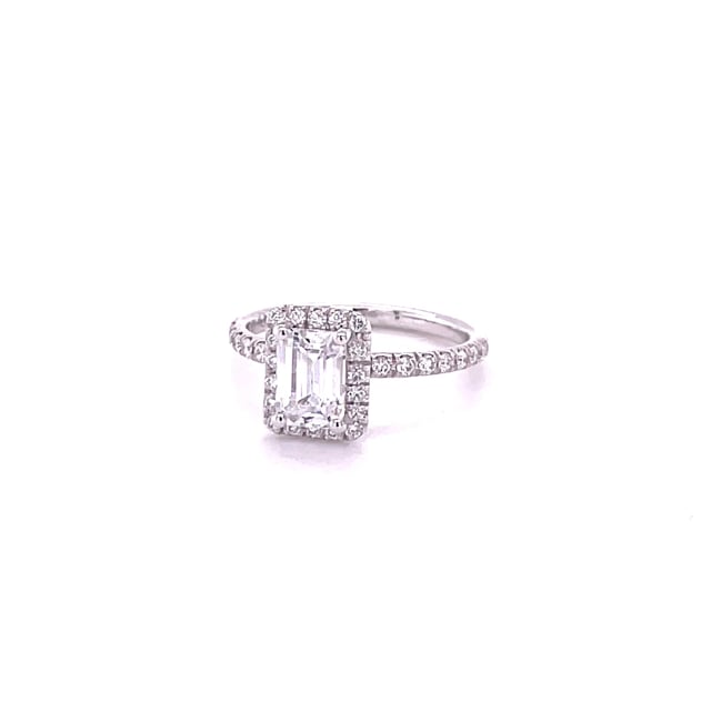 1.50 carat solitaire halo ring with an emerald cut diamond in white gold with round diamonds