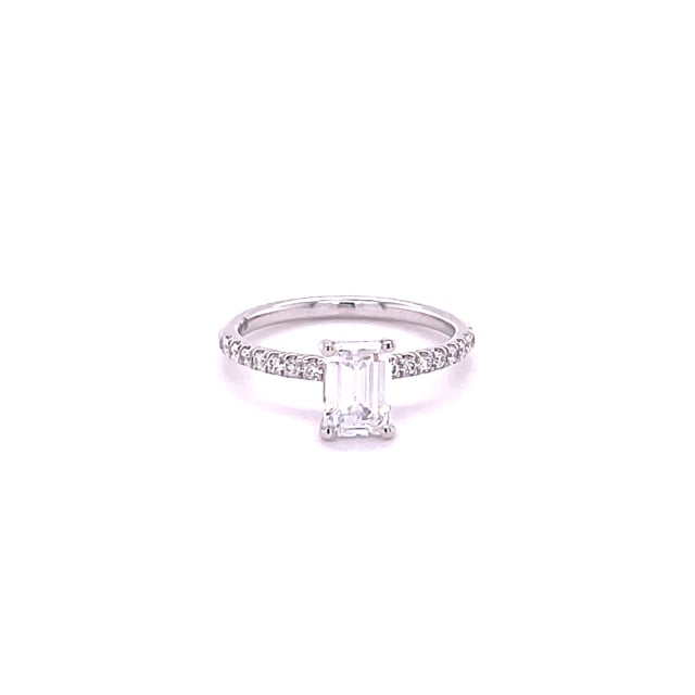 1.00 carat solitaire ring with an emerald cut diamond in white gold with side diamonds