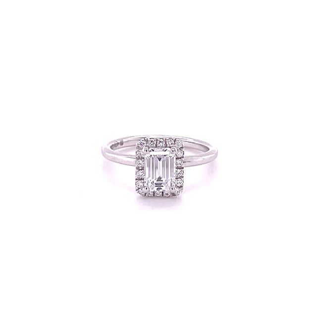 1.20 carat solitaire halo ring with an emerald cut diamond in white gold with round diamonds