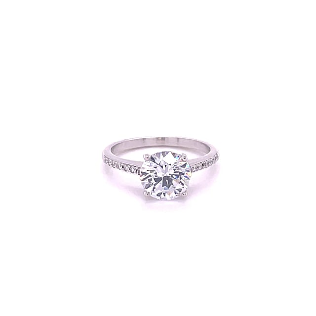 2.00 carat solitaire ring in white gold with four prongs and side diamonds