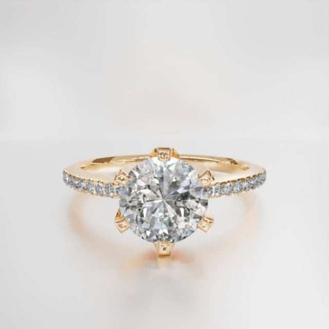 0.90 carat solitaire ring in yellow gold with side diamonds