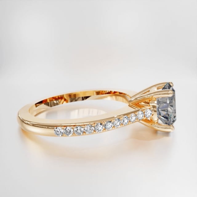 0.90 carat solitaire ring in yellow gold with four prongs and side diamonds