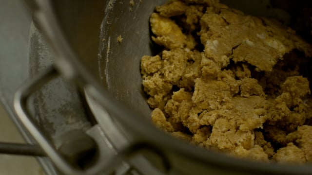Delicious cookie dough comes together as the giant industrial mixer turns the ingredients together. 