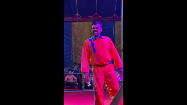 A goldfish is swallowed and regurgitated by a circus performer, Rambo Circus, Pune, India, 2021 (mobile phone footage)