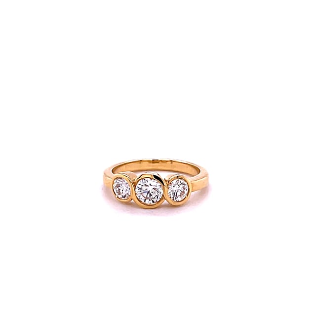 0.95 carat trilogy ring in yellow gold with round diamonds