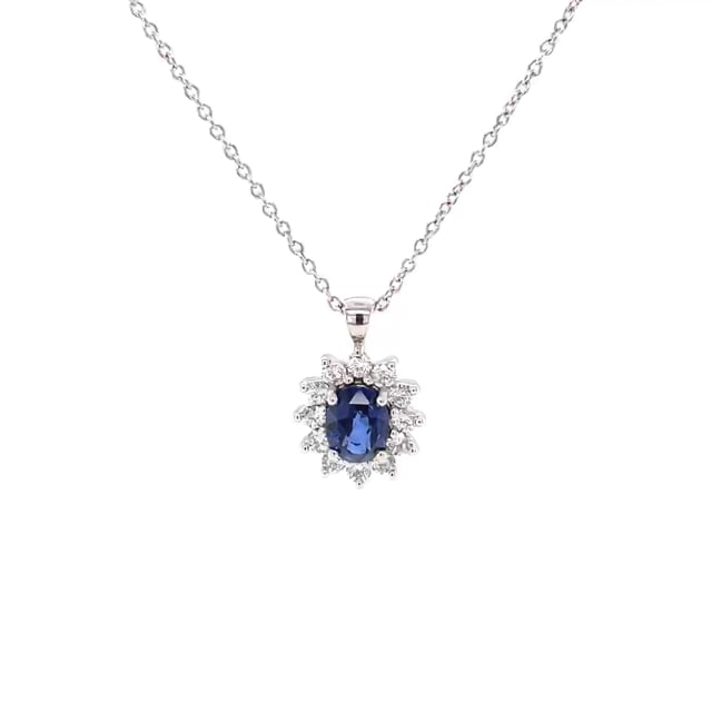 Entourage pendant in white gold with oval sapphire and round diamonds