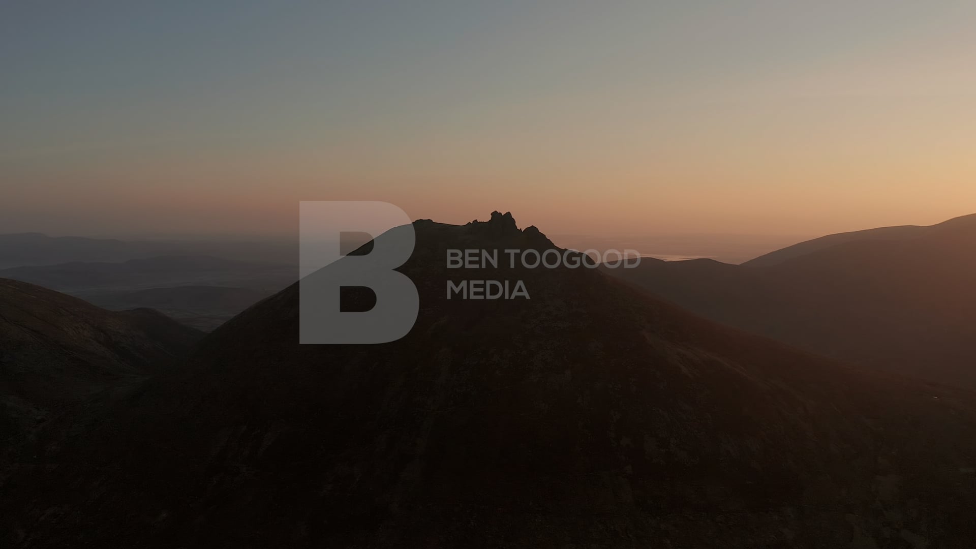 Aerial sunrise shot of Slieve Bernagh, Mourne Mountains in 4K