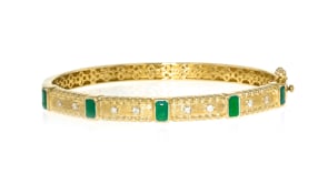 1.40 ct. t.w. Emerald and .14 ct. t.w. Diamond Bangle Bracelet in 18kt Gold Over Sterling