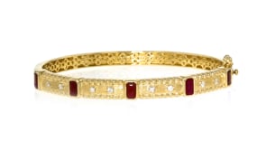 1.50 ct. t.w. Ruby and .15 ct. t.w. Diamond Bangle Bracelet in 18kt Gold Over Sterling