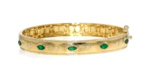 80 ct. t.w. Emerald and .26 ct. t.w. Diamond Bangle Bracelet in 18kt Gold Over Sterling
