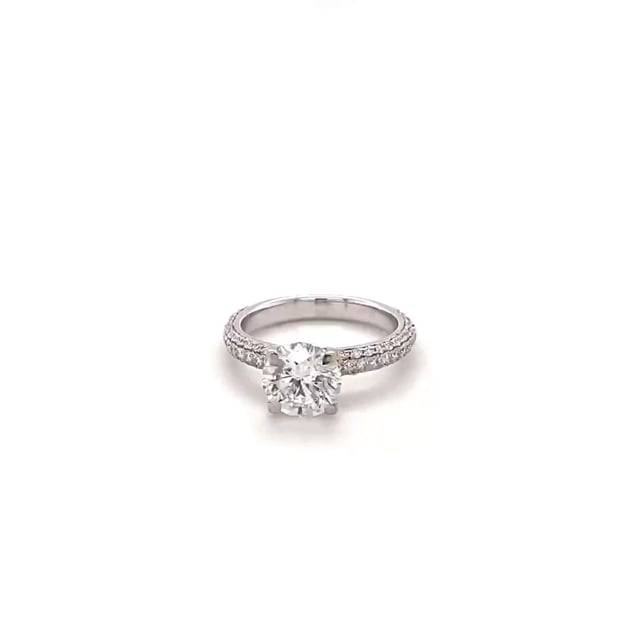 1.50 carat solitaire ring (half set) in white gold with side diamonds