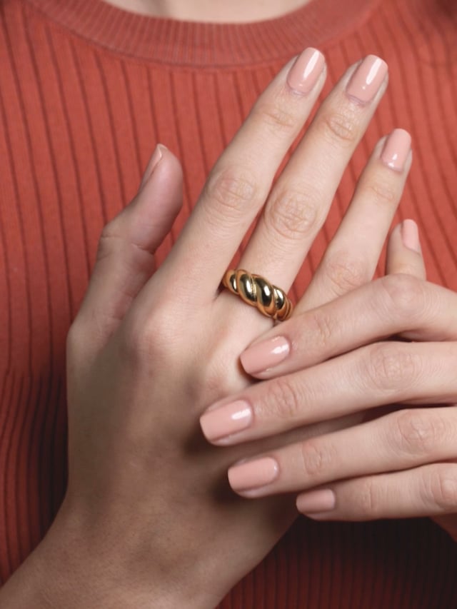 LOUIS VUITTON. Gold-plated ring twisted in the shape of …