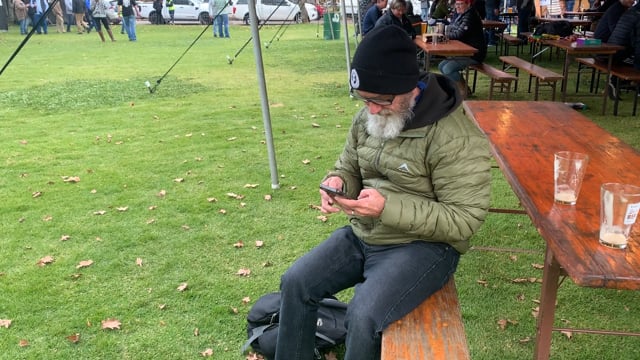 Man sitting using phone