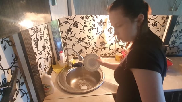 Woman washing dishes