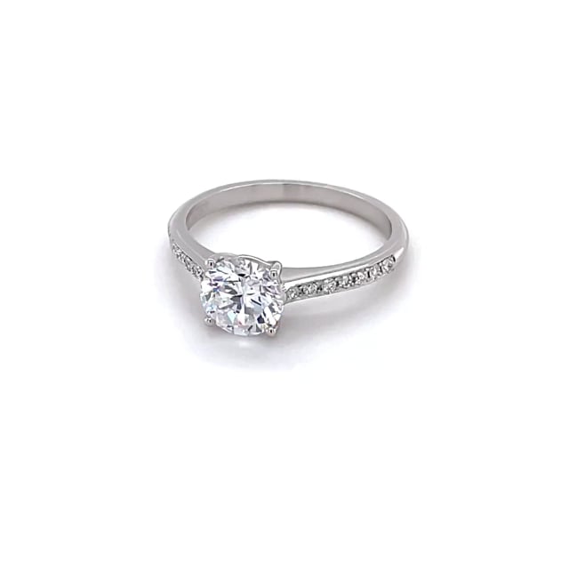 0.90 carat solitaire ring in white gold with four prongs and side diamonds