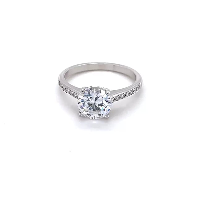 1.25 carat solitaire ring in platinum with four prongs and side diamonds