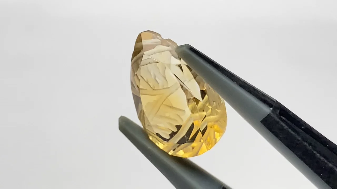 宝石質シトリンAAA 彫刻入りペアシェイプファセットカット14×10mm 1粒