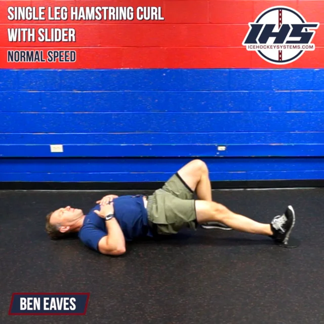 Starting position of the sliding leg curl. The hips are lifted into