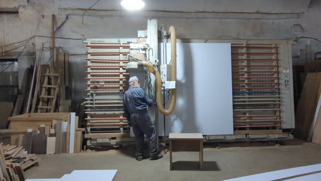 Man cutting chipboard