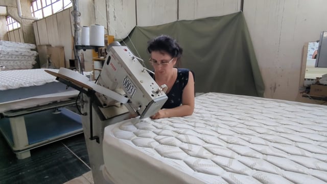 Woman making a mattress
