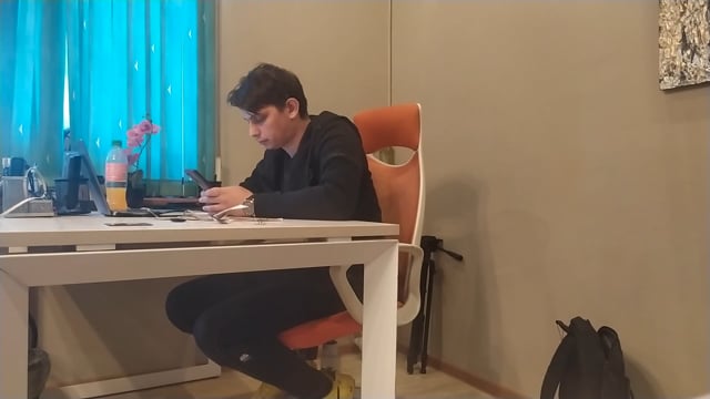 Man at desk on phone