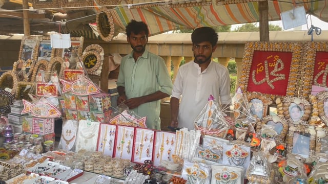 Men working at a stall