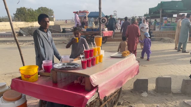 Young man working at drinks cart
