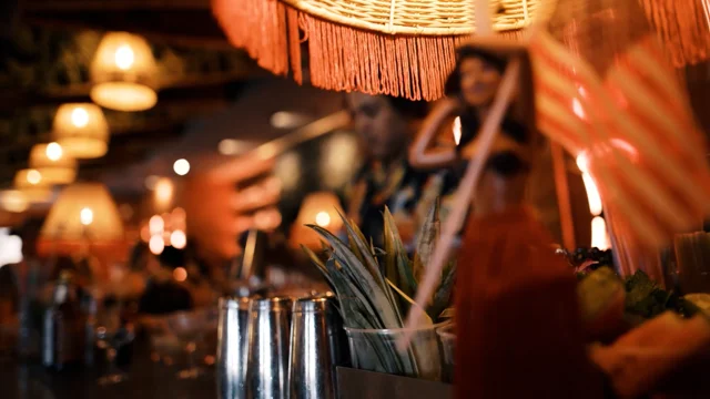 man in grass skirt with wine, Man in grass skirt with wine