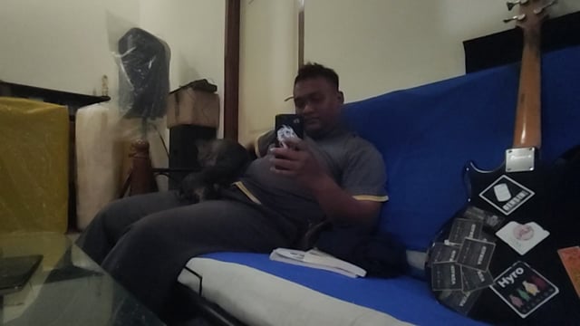 Man sitting with a cat