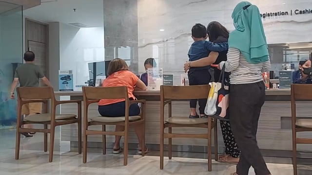 Waiting at registration desk