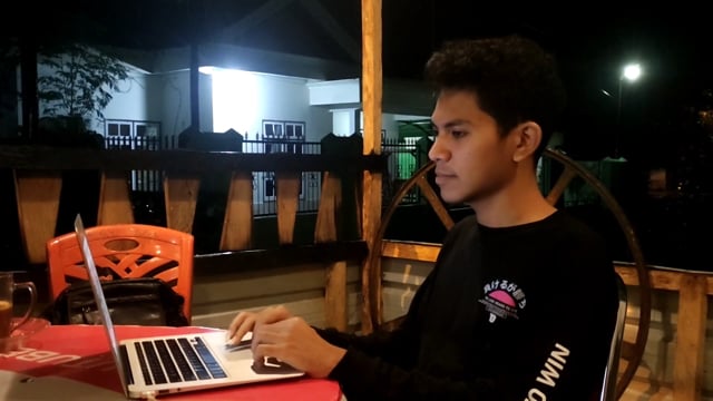 Working on laptop at night