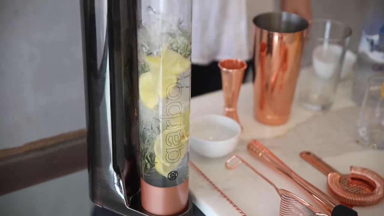 Qarbo Sparkling Water Maker and Fruit Infuser making cocktails at home