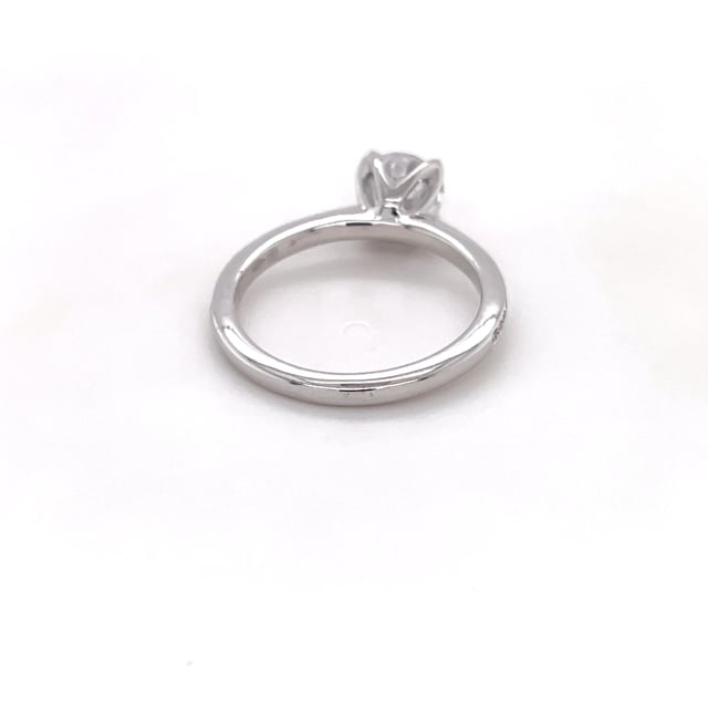 0.70 carat solitaire ring in white gold with side diamonds