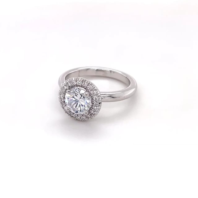1.25 carat solitaire halo ring in yellow gold with round diamonds