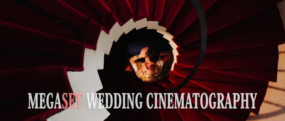 Bride and groom posing on round stairs