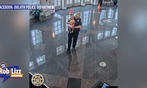 Cop Holds Her Baby While She Gets a Job
