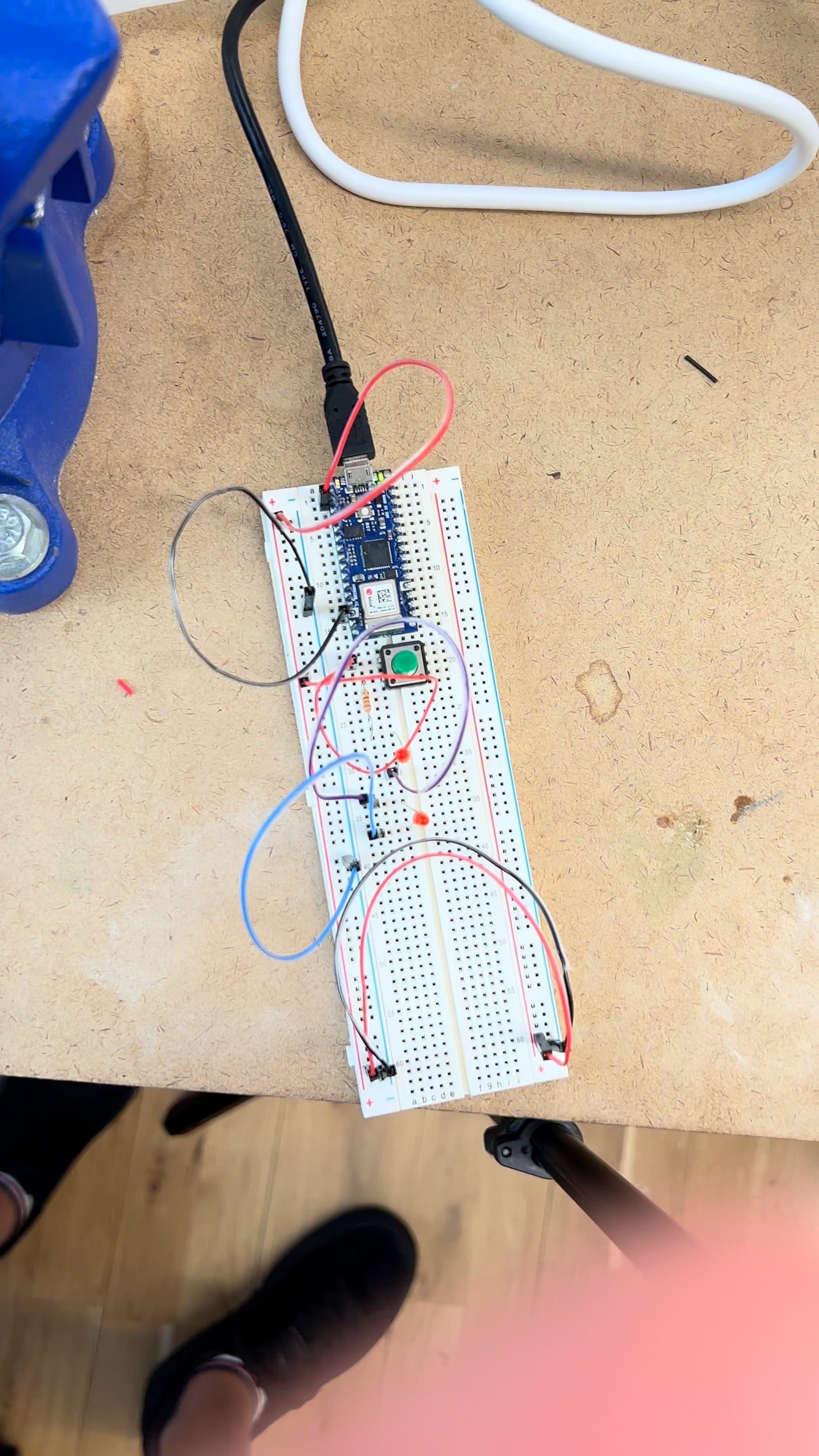 Pushbutton controlling two LEDs on Vimeo