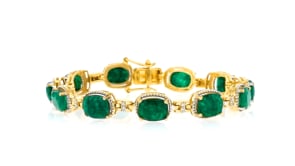 13.00 ct. t.w. Emerald and .18 ct. t.w. Diamond Bracelet in 18kt Gold Over Sterling