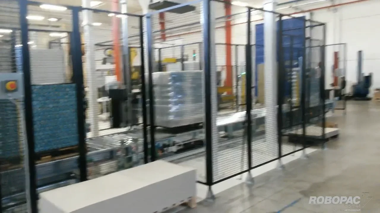 Metal cans stretch wrapped for shipment by the Robopac Helix 1 EVO ...