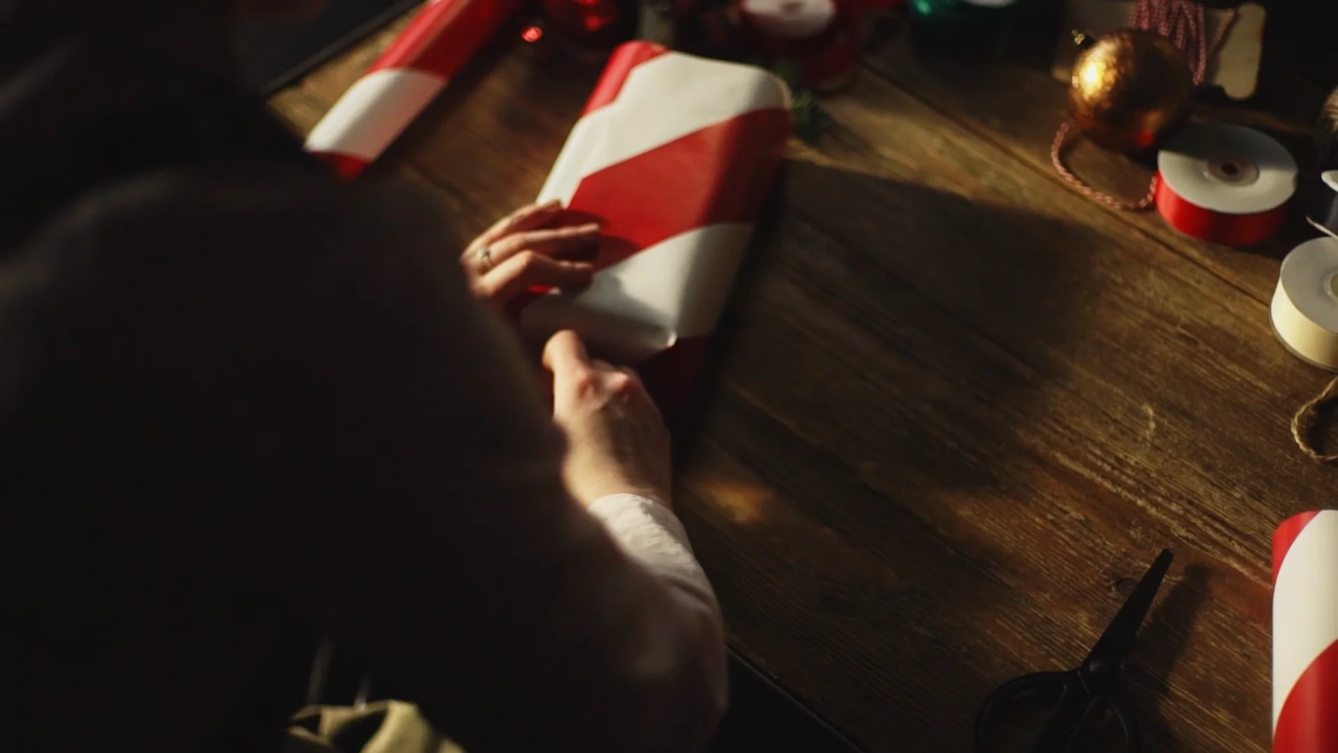 Over the shoulder view wrapping gift