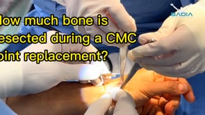 How much bone is removed during a thumb joint replacement procedure?