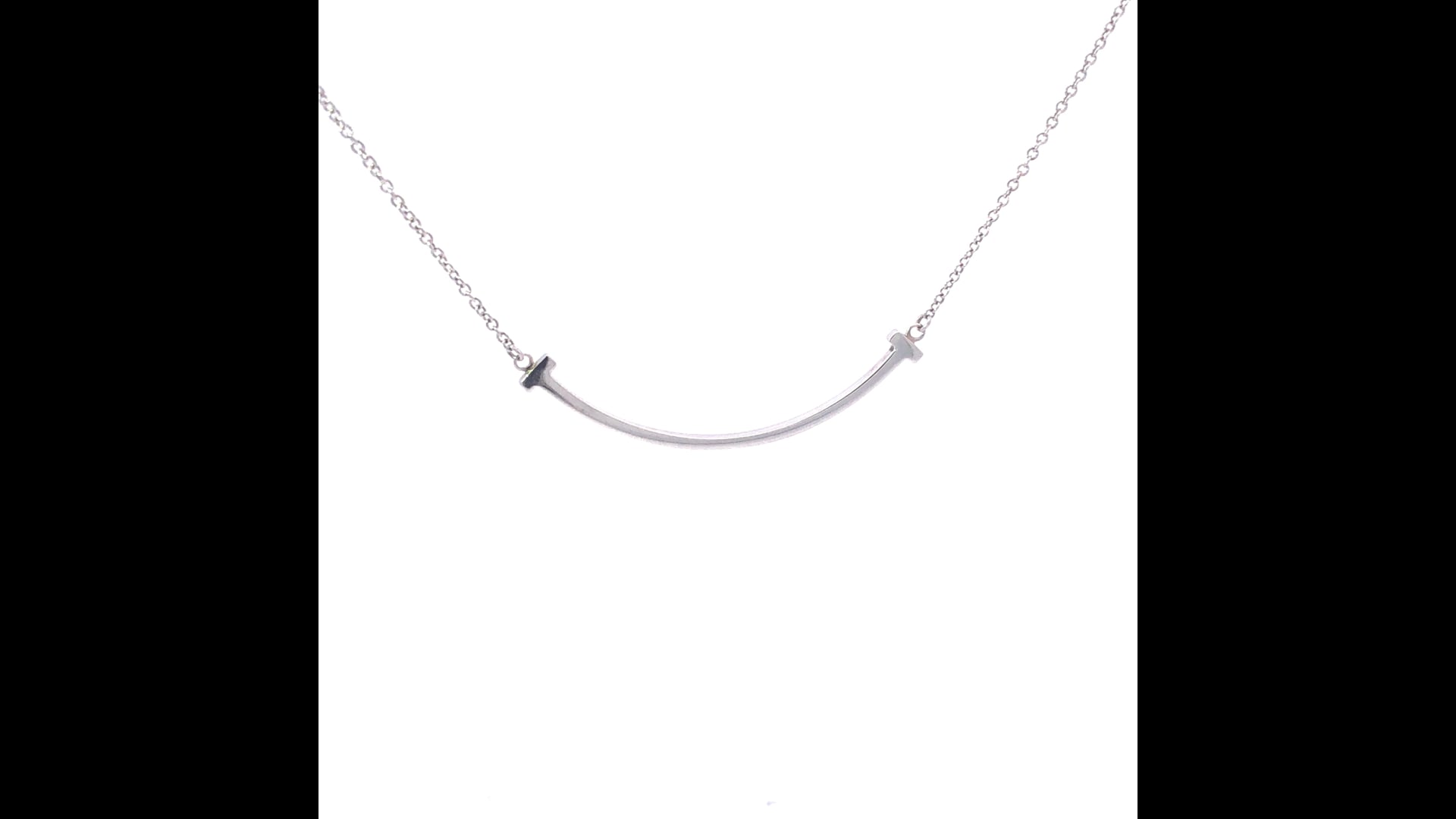 Tiffany and Co. T Small Smile Pendant Necklace in Sterling Silver