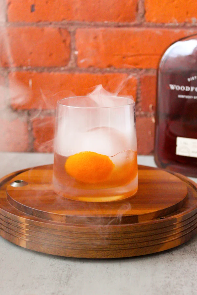 Glass of bourbon over smoked ice cubes garnished with smoked oranges. It's  1700 somewhere : r/Traeger