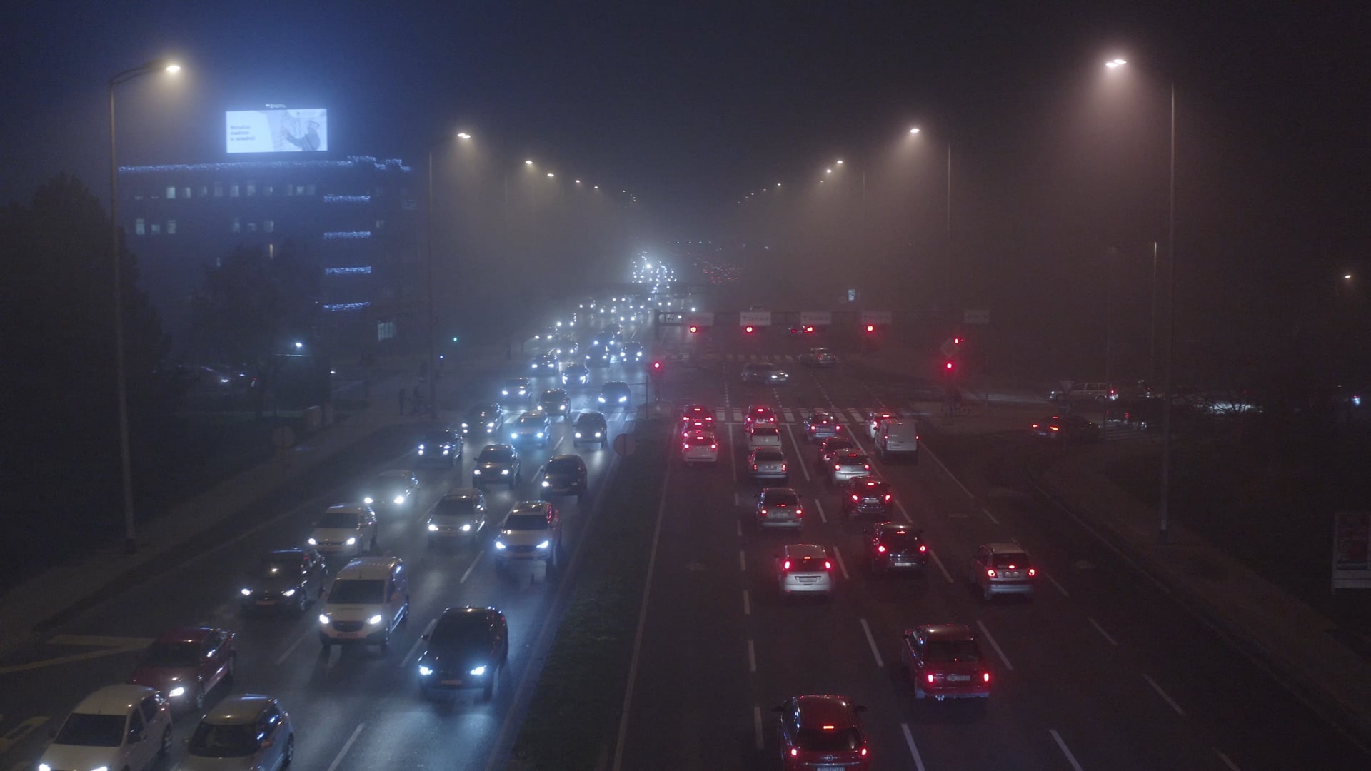 Night traffic in Zagreb, red lights turn to green, lowering the perspective and moving with the traffic