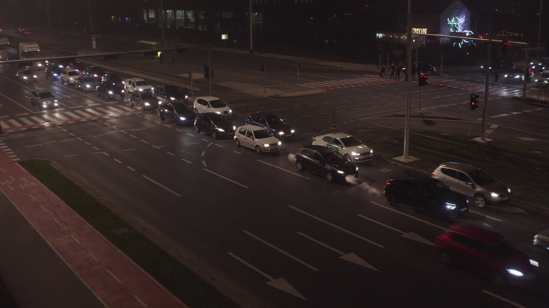 Night traffic, traffic jam, bike passing by on the bike road