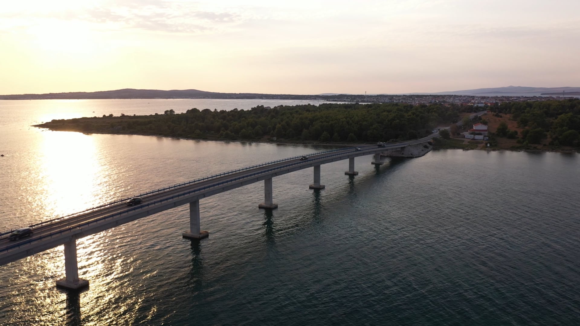 Moving over the bridge, cars driving on the bridge across the sea, rotating, 360° view